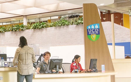 Staff sitting at student desk ucd